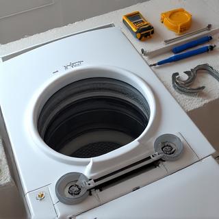 Isang washing machine na may mga tool sa tabi.